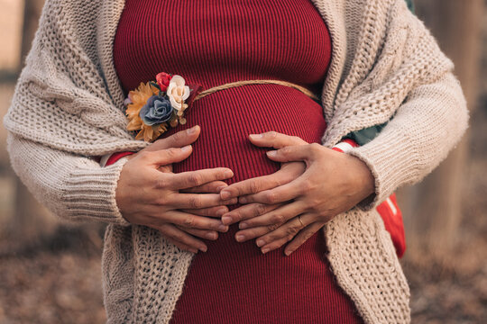 woman holding a pregnant belly