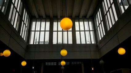 building with yellow and orange light and windows