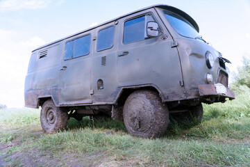 Dirty wheel of an old military SUV in sticky mud