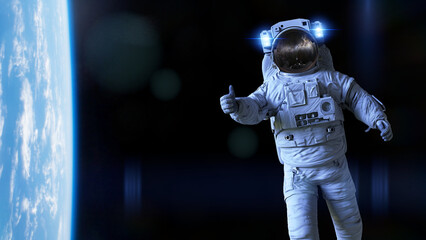 astronaut showing a thumbs up during space walk in Earth orbit background  © dottedyeti