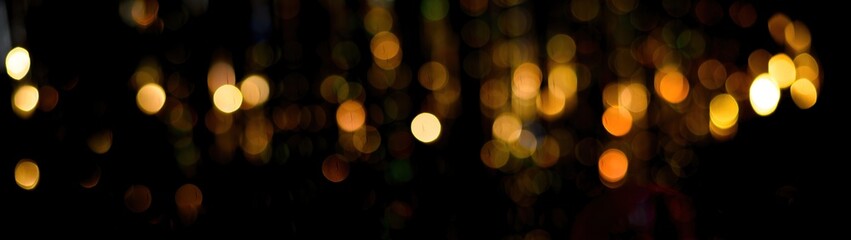 background banner bokeh of golden lights. defocusing