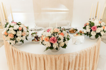 wedding banquet. flowers and food are on the festive table. empty festive table in the restaurant.