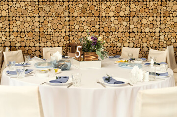 wedding banquet. flowers and food are on the festive table. empty festive table in the restaurant.