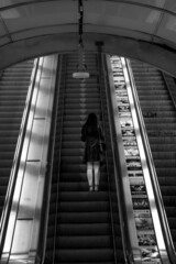 Woman on escalator