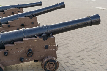 Black iron replica cannons from battleship Goto Predestination on Admiralteyskaya Square in...