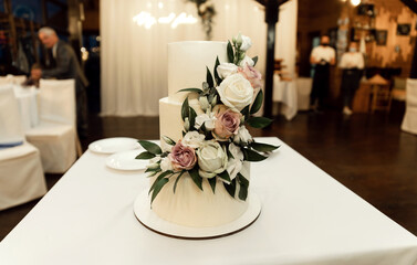 amazing wedding cake isolated on beautiful background. dessert at a wedding banquet. tiered cake