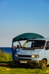 Fototapeta na wymiar Camper van camping on sea shore