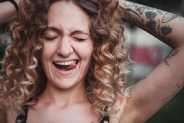Portrait of curly-haired woman on the street