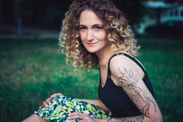 Portrait of curly-haired woman on the street