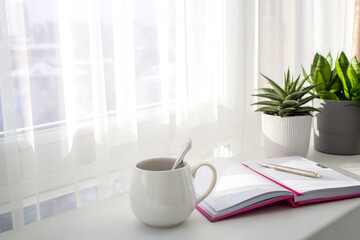 Daily planner for 2022, plans, morning coffee in sunny morning rays