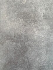 closeup of a natural concrete look ceramic stone surface in different grey tones ideal for interior design projects, graphic work projects and much more