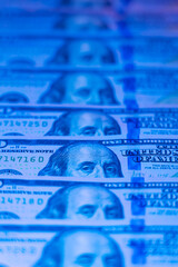 Money background. Dollars. Finance and wealth in blue neon light