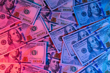 Money background. Dollars lighted by blue and red. Financial market