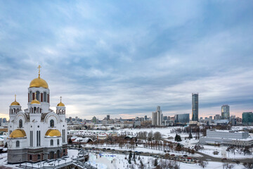 Winter Yekaterinburg and Temple on Blood in beautiful cloudy sunset. Aerial view of Yekaterinburg, Russia. Translation of the text on the temple: Honest to the Lord is the death of His saints.