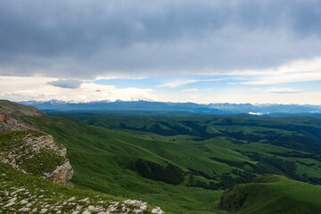 Naklejka na ściany i meble View of Elbrus and the Bermamyt plateau in the Karachay-Cherkess Republic, Russia. The Caucasus Mountains.
