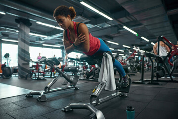 Fototapeta na wymiar Girl exercise for lumbar on in fitness center
