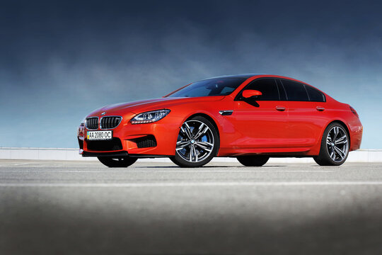 Kiev, Ukraine - June 22, 2014: Red BMW M6 Gran Coupe on a background of sky