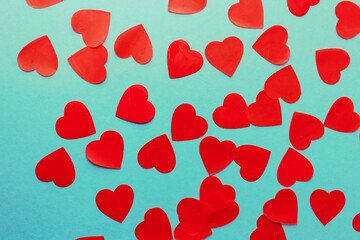 Valentine's Day. Frame made of haerts confetti on blue background. Valentines day background. Flat lay, top view