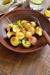 Simple salad with young potatoes with mustard-lime sauce, vertical, copy space