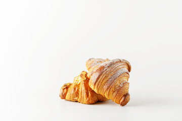 Delicious fresh croissants isolated on white background.