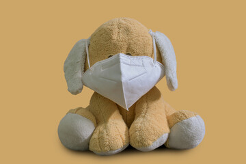 stuff toy puppy wearing N95 mask