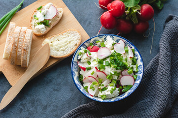 Cottage cheese with freshly cut chives and radish. Light nutritious breakfast