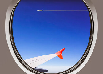 Airplane window view during a daytime flight above clouds creating an amazing skyscape thru airplane window, especially another A380 flying alongside afar (illustration), a conceptual design.
