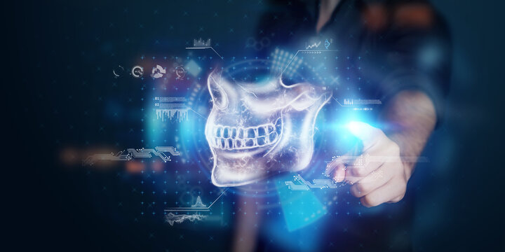 A man looks at the hologram of the jaw, 3D x-ray of the skull. Modern Dentistry, orthodontist, toothache, bite, future technologies.