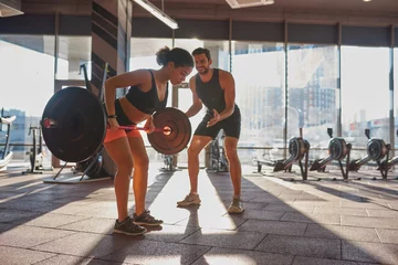  Trainer tell at girl do exercise in sunny gym © Svitlana