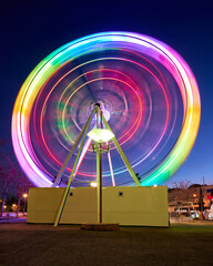 Colorful Ferris wheel in amusement park at night
