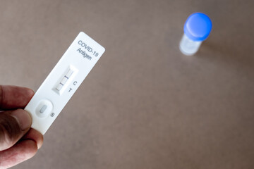 Covid 19 antigen rapid test kit with positive result for infection. Coronavirus rapid self-test...