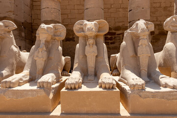 A pile of effigies of rams arranged in a row, Karnak temple, Luxor, Egypt.