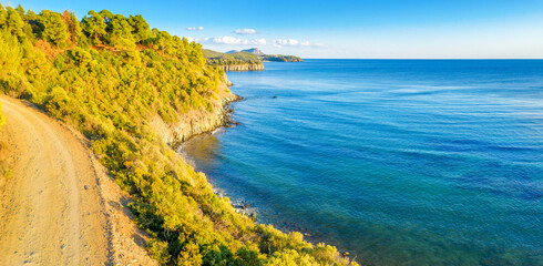 Aerial panorama of summer seascape of Mediterranean sea. Green hills of Peloponnese peninsula, Greece, Europe.