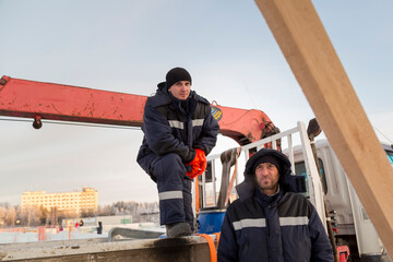 Two workers at the site of the ice camp