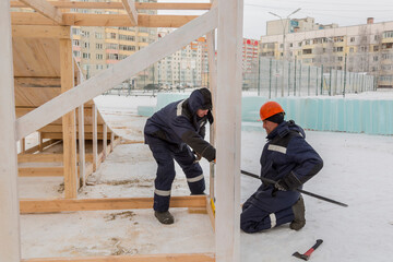 Portrait of installers when working with a level