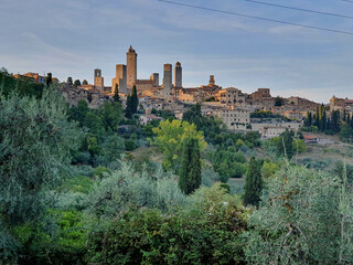 Fototapeta na wymiar Typical Tuscany old city with beautiful stone towers in sunlight, Italy