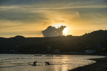Fishing village children practicing waterboarding at Bulalacao, Oriental Mindoro, Philippines. Endless fun & excitement. 