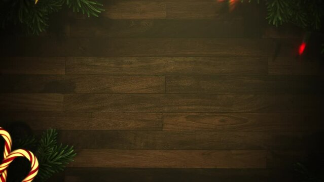 Candy and Christmas tree branches on wood, motion holidays and winter style background for New Year and Merry Christmas