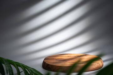 Wooden podium with leaves and shadows. Realistic wood platform for product presentation. Minimal...