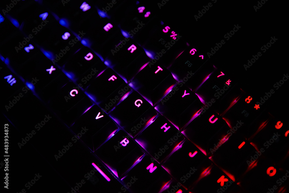 Poster gaming keyboard, close up. mechanical rgb keyboard for computer games on dark backgound