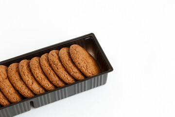 Oatmeal cookies in the package are isolated on a white background.