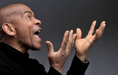 men screaming with fear with hands up high on grey background stock photo