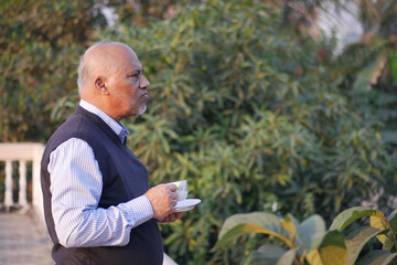 Fototapeta premium senior man drinking tea in nature 