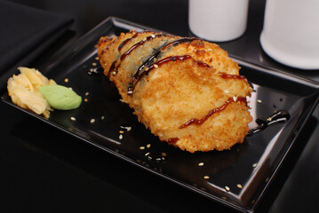 Fried Salmon fish Temaki in black background