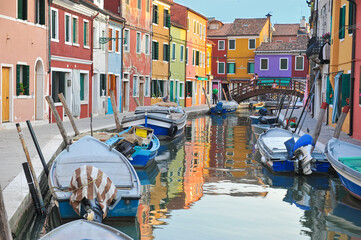 VENICE, ITALY: Burano island, architectural details of multi-colored houses of locals. Traditional colorful houses - one of attractive tourist objects in the Venetian lagoon