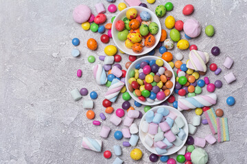 Bright sweet multicolored dragee, candies, lollipops, marshmallows