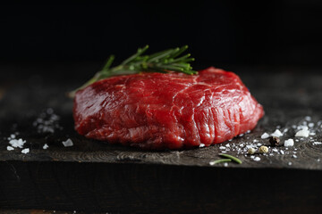 Peace of meat on dark board
