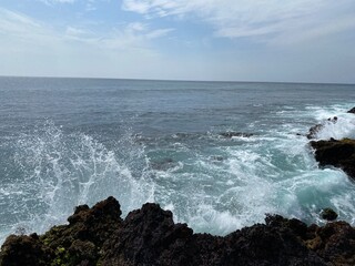 waves breaking on the rocks
