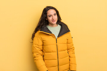 hispanic pretty woman looking proud, confident, cool, cheeky and arrogant, smiling, feeling...