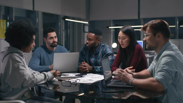 Group Of diverse businesspeople meeting around table In office